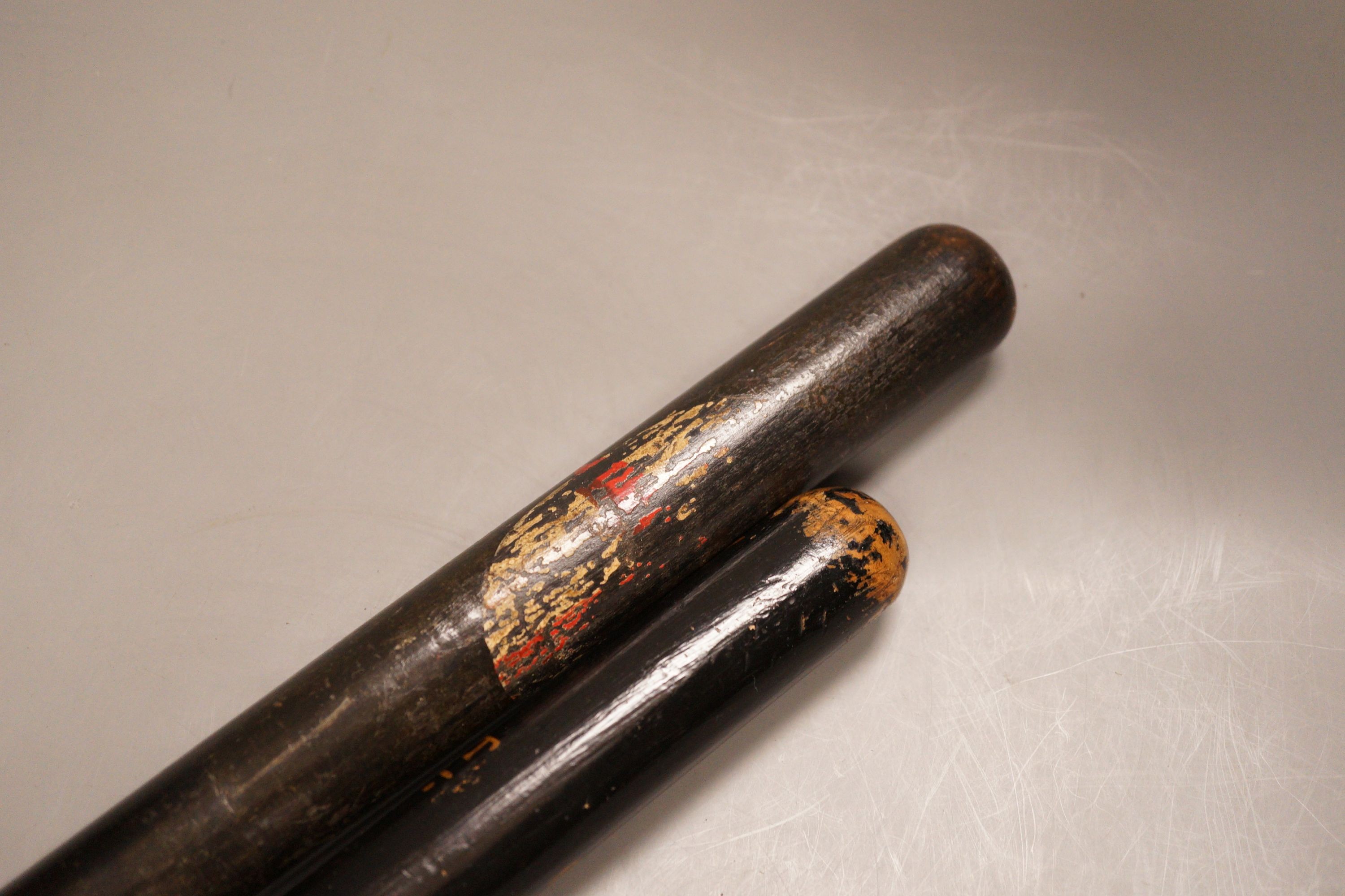 Two Victorian painted truncheons, one ‘Sergt. 21 E.S.C’, the other painted with St. George’s cross, 47cm